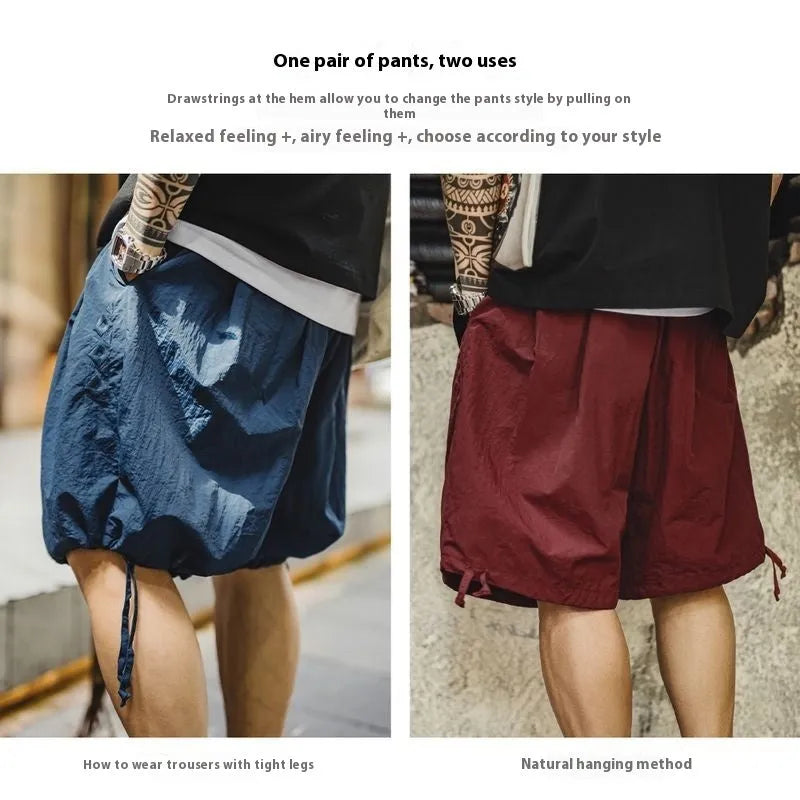 Men's loose fit nylon shorts in Prussian Blue with embroidered detailing