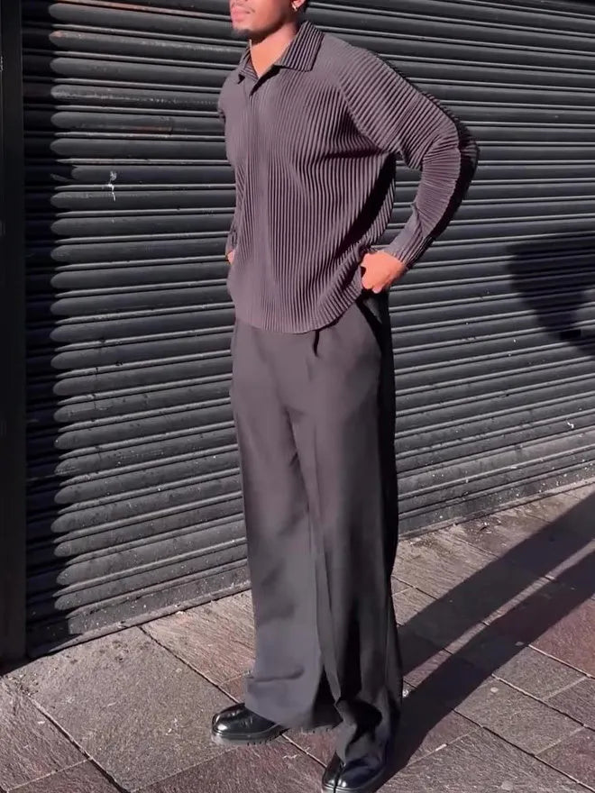 Black men's long-sleeved casual top with a pleated front detail, shown in a regular fit.