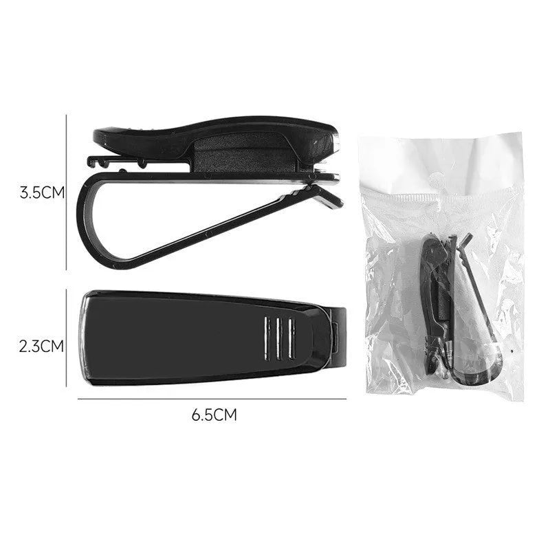 Black plastic clip for car sunshade to hold sunglasses and tickets.