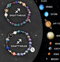 Two natural stone beaded bracelets with zodiac charms on a wrist, showing the adjustable metal clasp.