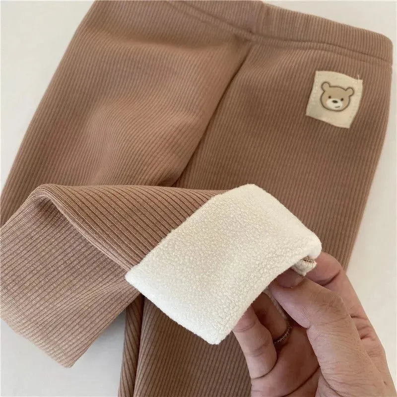Girls' high-waisted fleece-lined leggings in beige, black, brown, and grey colours with a wool lining.