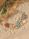 Women's alloy rhinestone bracelet with marine anchor, shell, star, and starfish motifs in blue, red, or turquoise.