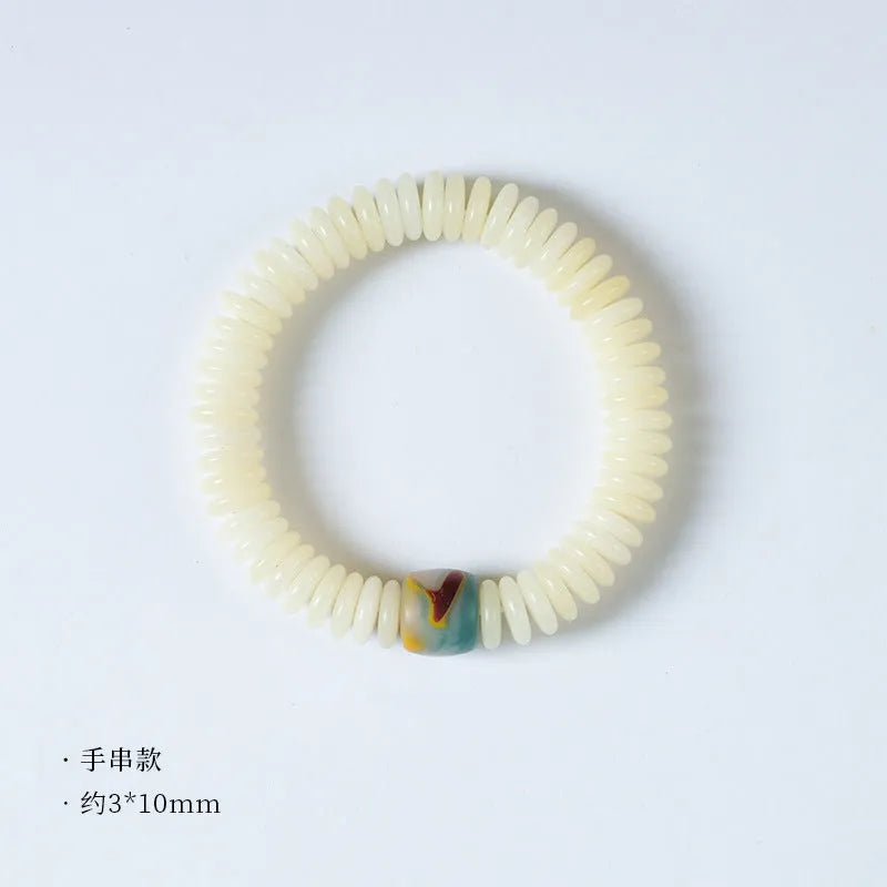 Tibetan white bodhi seed Buddhist bracelet or handheld mala with traditional knotting