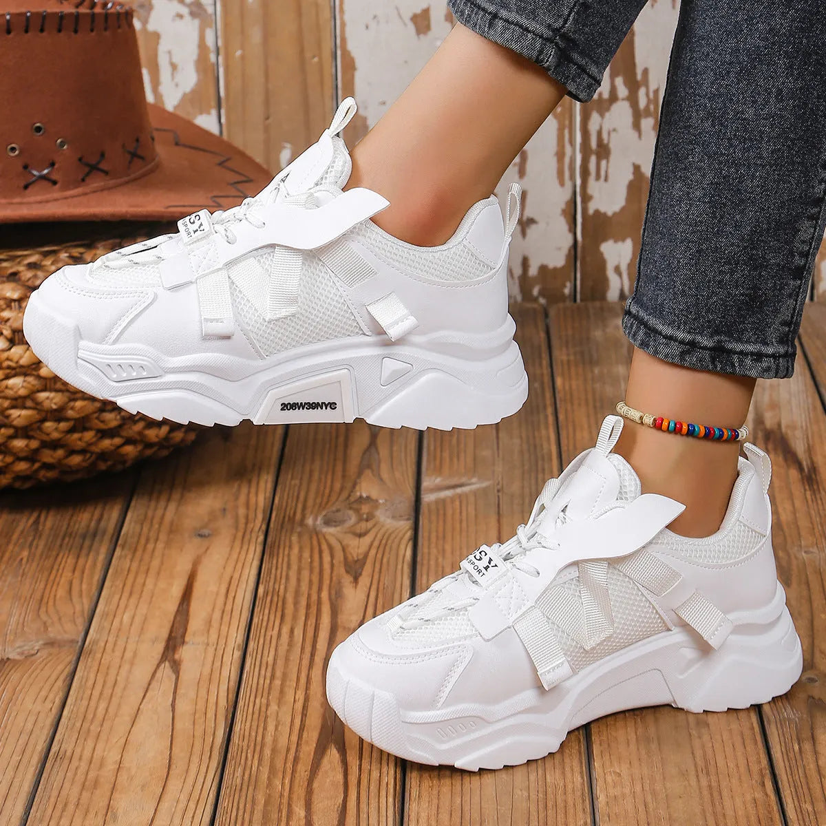 Women's purple platform mesh sports trainer with animal pattern and lace-up front.
