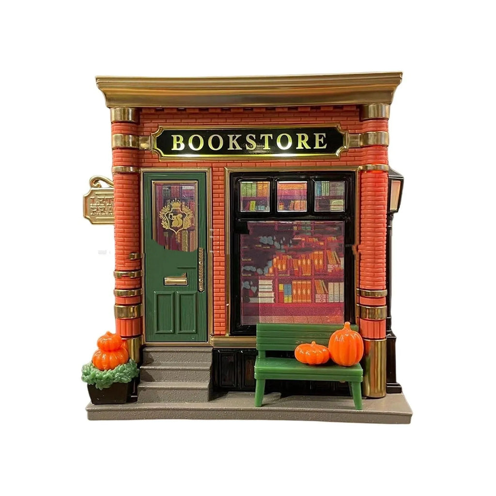 Small cartoon house-shaped night light ornament with festive design, made from resin and plastic.