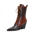 Retro dark brown women's ankle boots with pointed toe, chunky heel, side zipper, and stone pattern stitching.