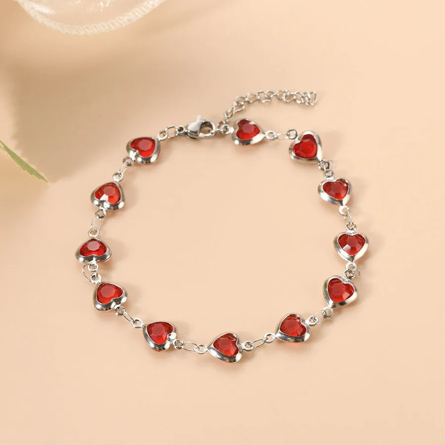 Geometric stainless steel heart bracelet showing six electroplated colour options on white background