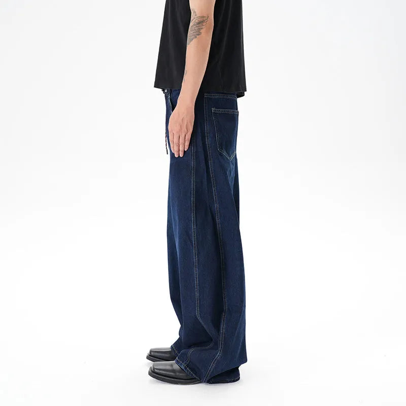 Dark blue wide leg women's jeans with a machete cut and distressed detailing on denim fabric.