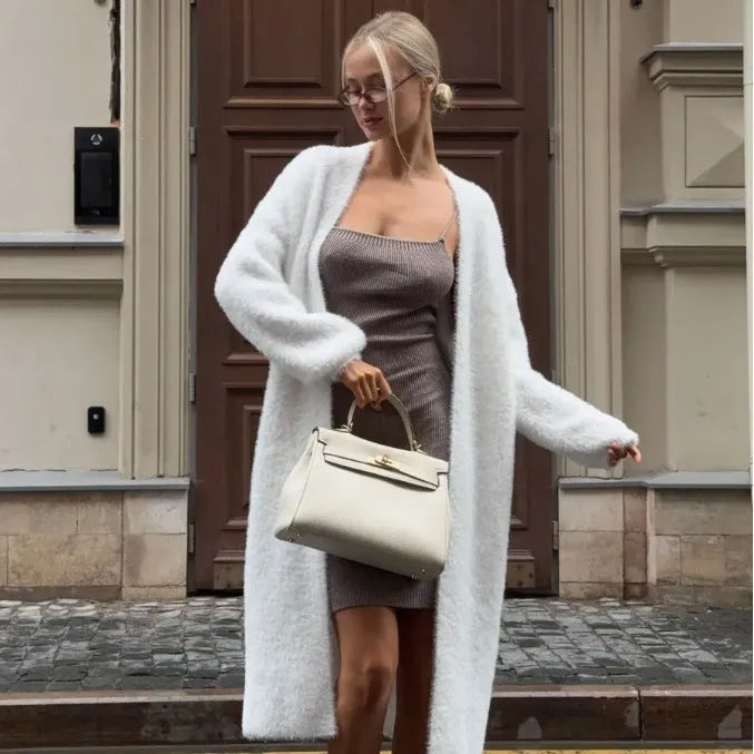 White women's cardigan sweater jacket with extended length and loose fit