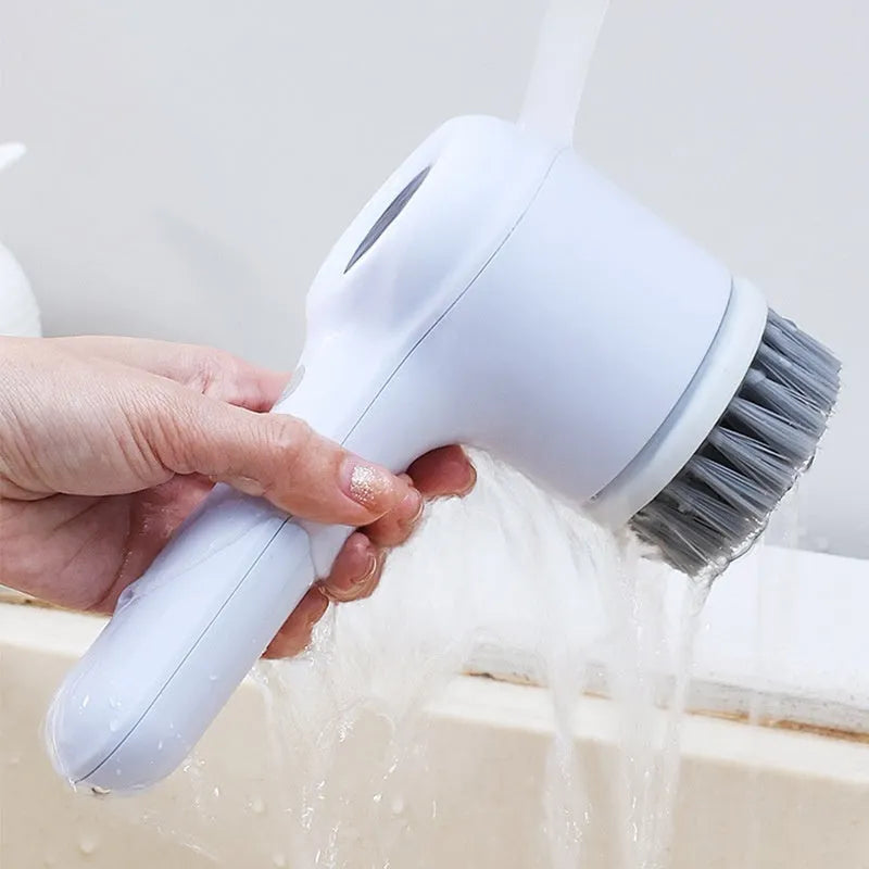 USB rechargeable electric cleaning brush in light grey or purple with multiple cleaning heads for kitchen use