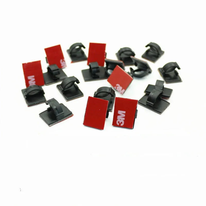 Plastic self-adhesive flat cable buckle clamp for automotive wire management in black or white.