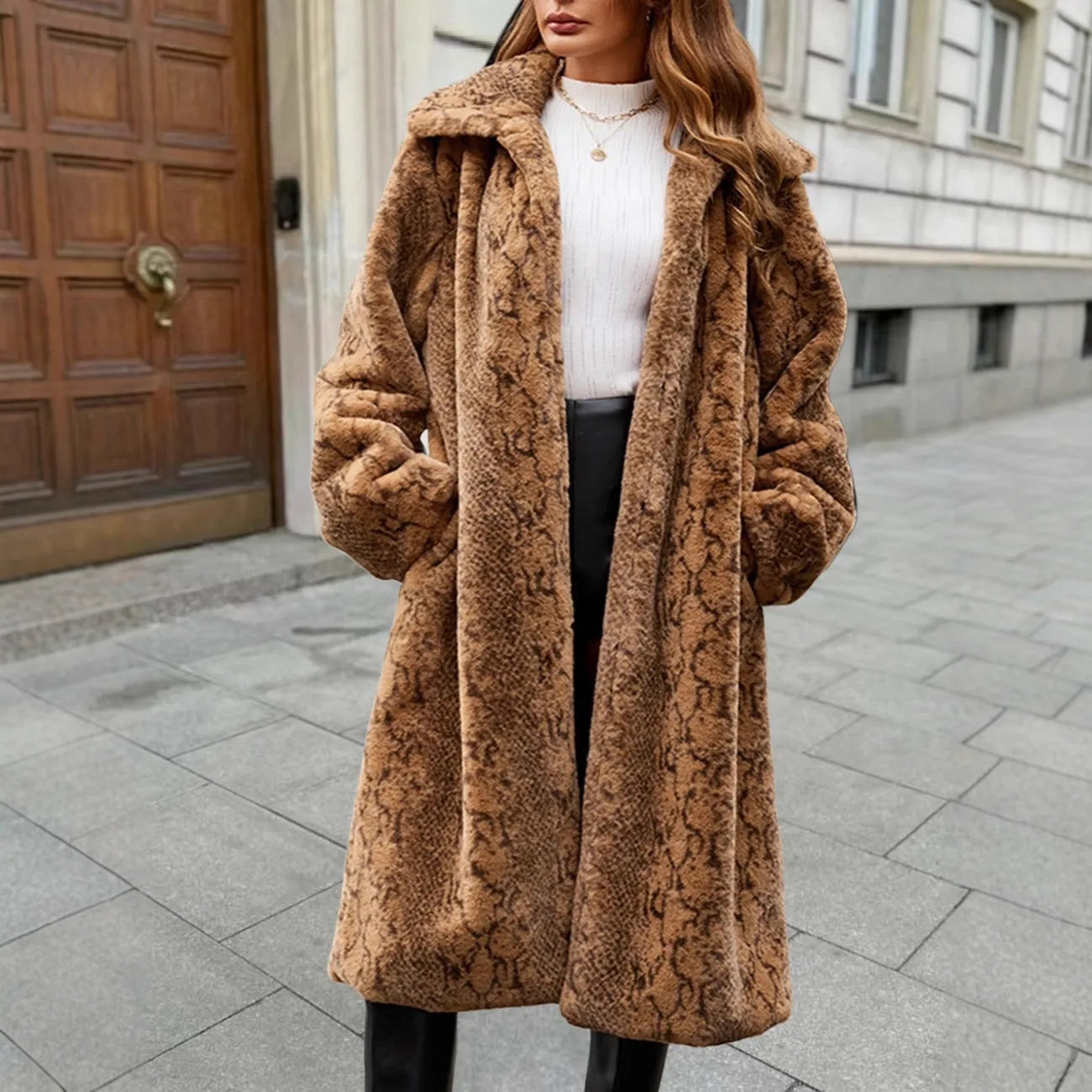 Women's long faux fur coat in a leopard print pattern with regular sleeves.