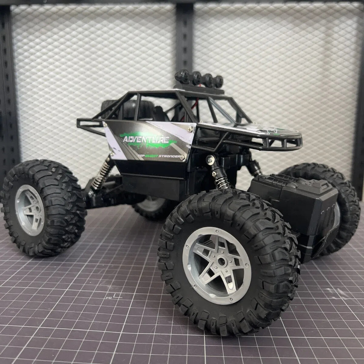 Children's remote control off-road model car in fire blue with four-wheel drive and rechargeable battery