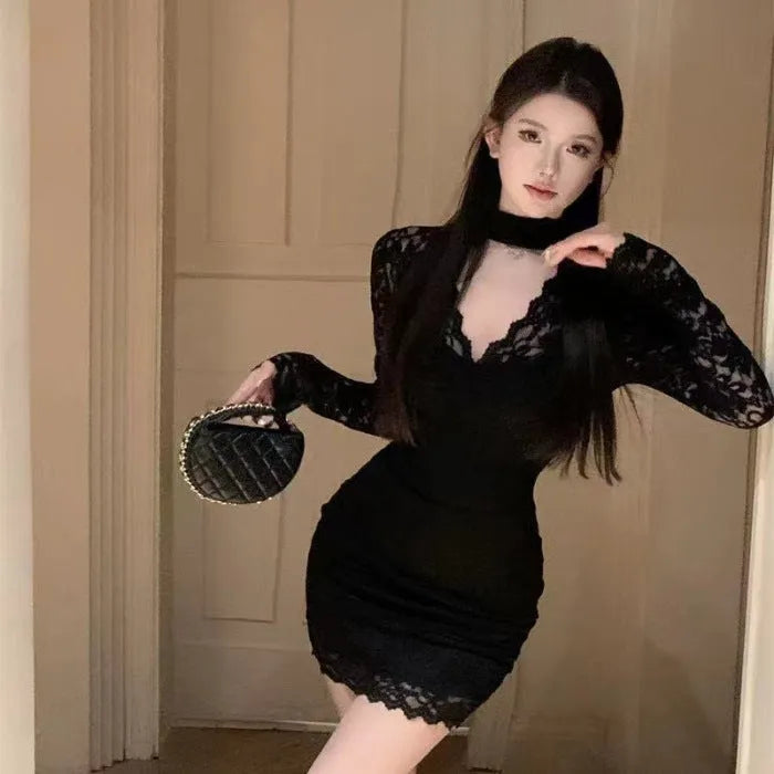 Women's black halter neck lace A-line dress with high waist and floral pattern.