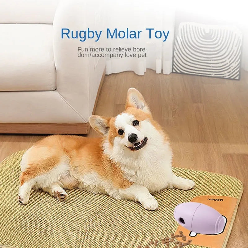 Blue silicone rugby ball dog chew toy with multiple small food leak holes on a white background.