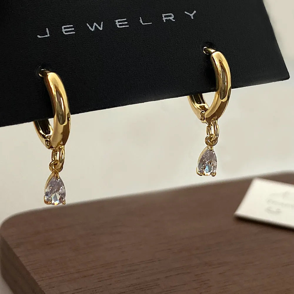 Women's zircon jewellery set with geometric pendant necklace, matching earrings and anklet in meteor shower design