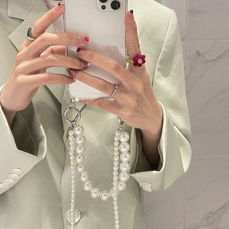 Soft silicone iPhone case with large pearl decoration and attached chain in Japanese Korean style
