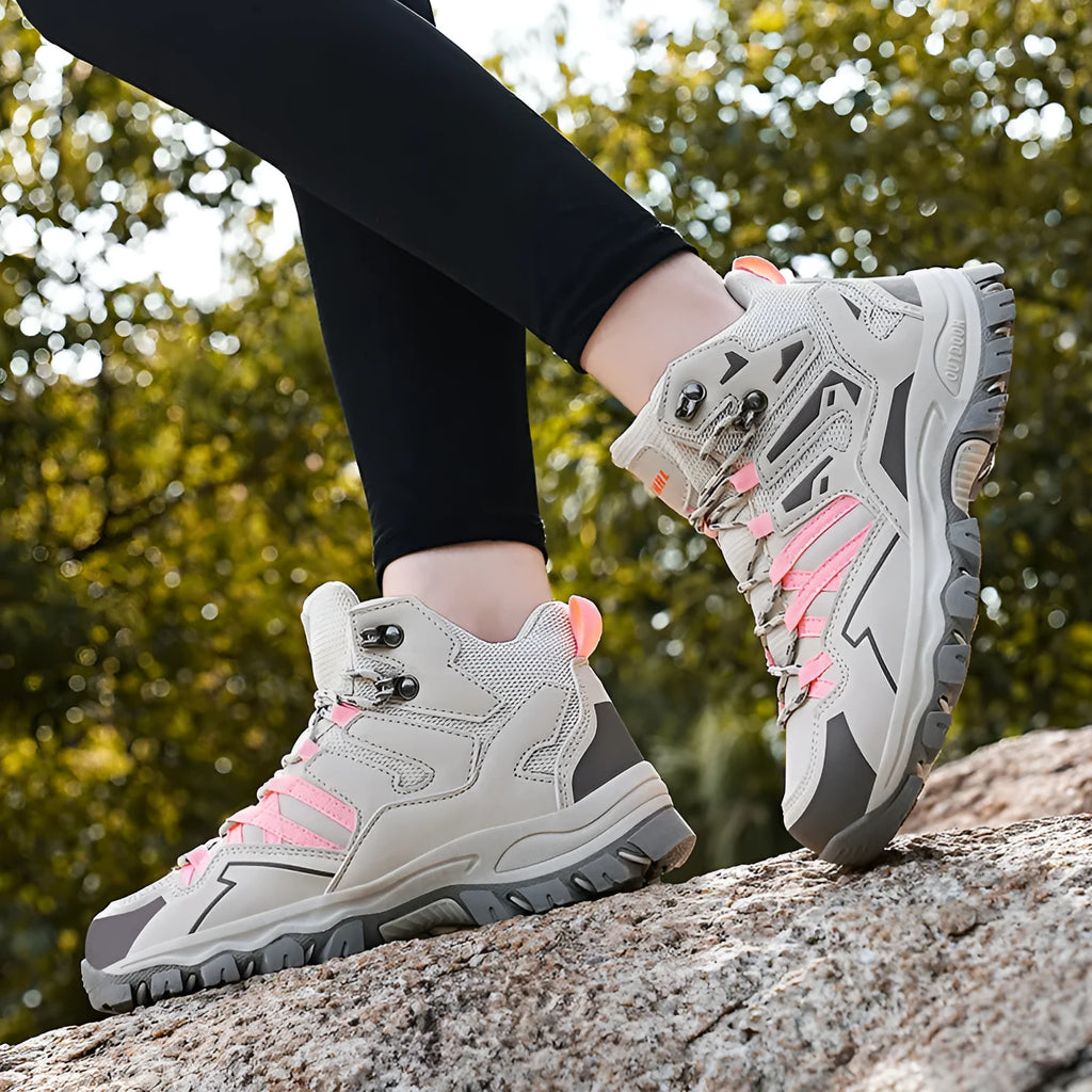 Low-top hiking sneakers in multiple colours on a rocky outdoor trail.