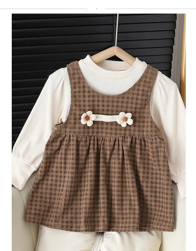 Baby girl wearing a dark coffee plaid long-sleeved dress and matching shirt, Korean style two-piece set.