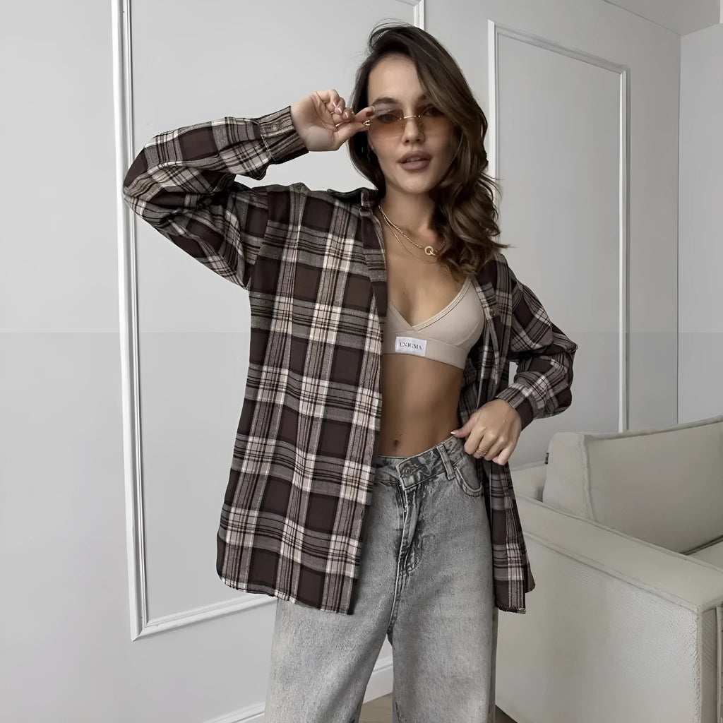 Dark brown striped women's long sleeve retro shirt on a hanger, showing collar and sleeve detail.