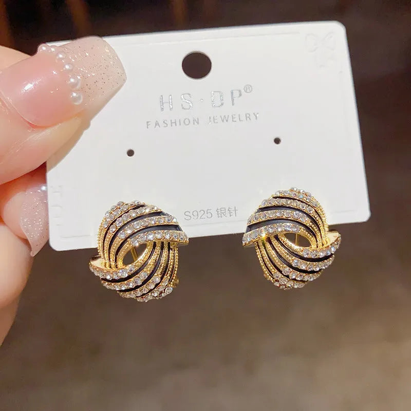 Super-flashing rhinestone ear studs with geometric ring shape and real gold plating on copper