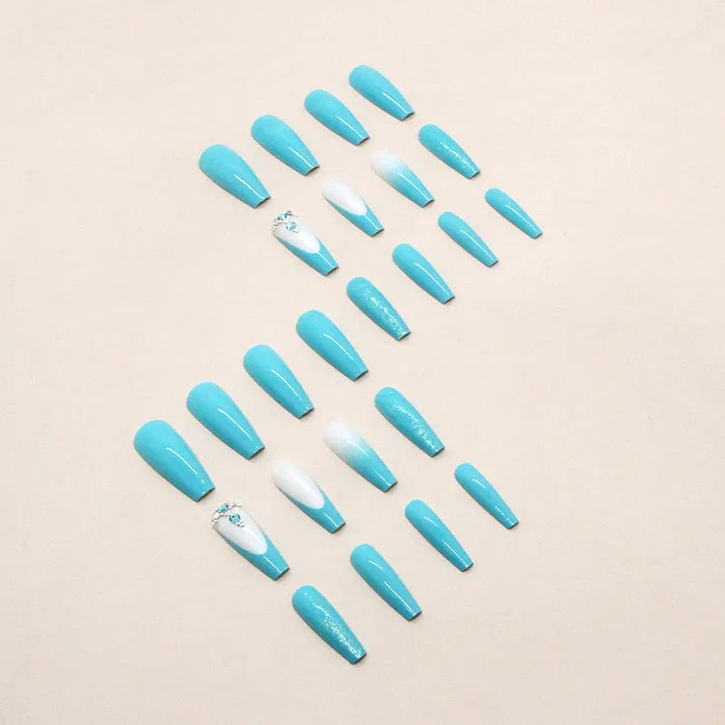 Long ballet-shaped false nail art patches in solid smart blue diamond colour with a tube of nail glue.