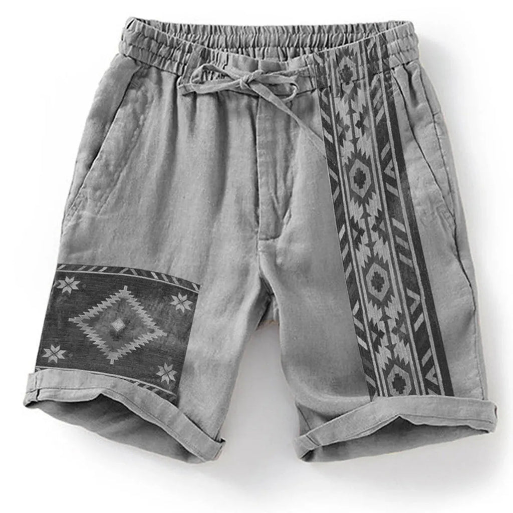 Man wearing blue colour block digital print casual shorts with a lace-up drawstring waist.