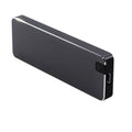 Silver portable metal-shell solid state hard drive with USB cable on a grey background.