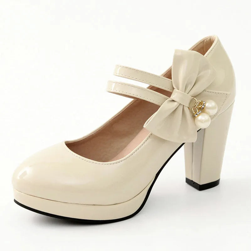 Red waterproof platform shoes with a thick chunky heel, round toe, and buckle fastening on the side.