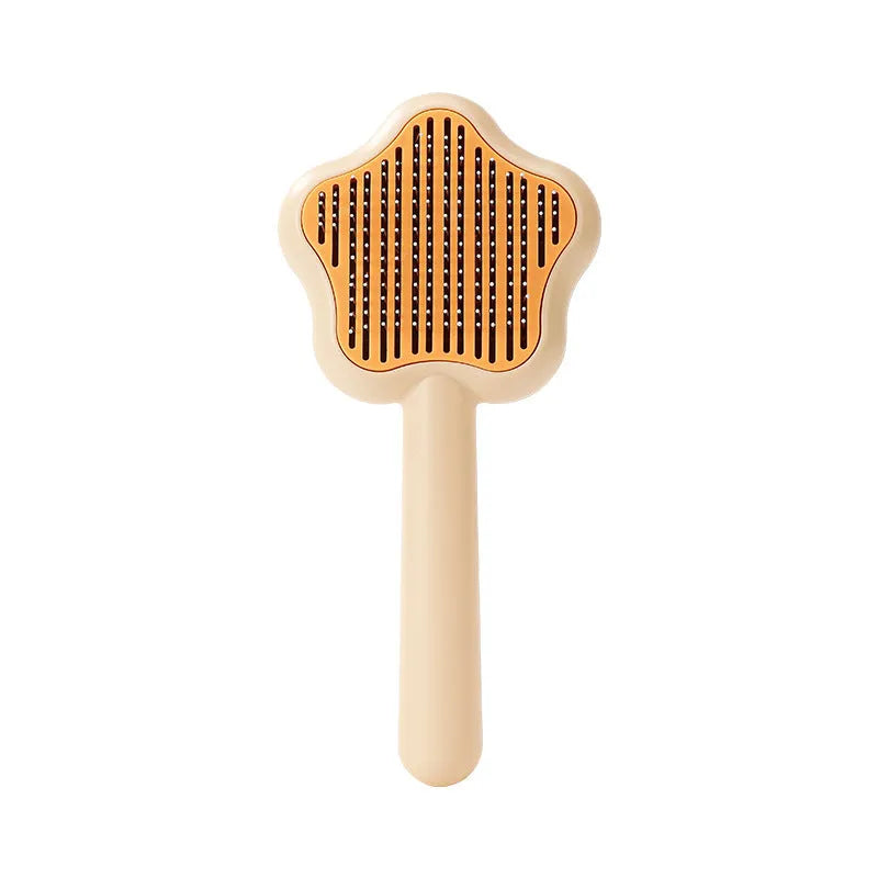 Green self-cleaning cat comb with four stainless steel needles measuring 20cm long
