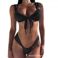 Women's solid colour bikini set with lace-up front top and split hip briefs.