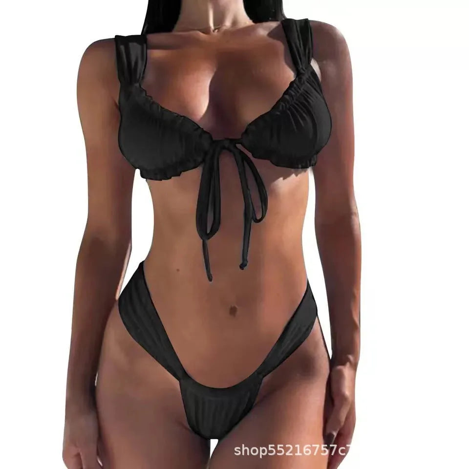 Women's solid colour bikini set with lace-up front top and split hip briefs.