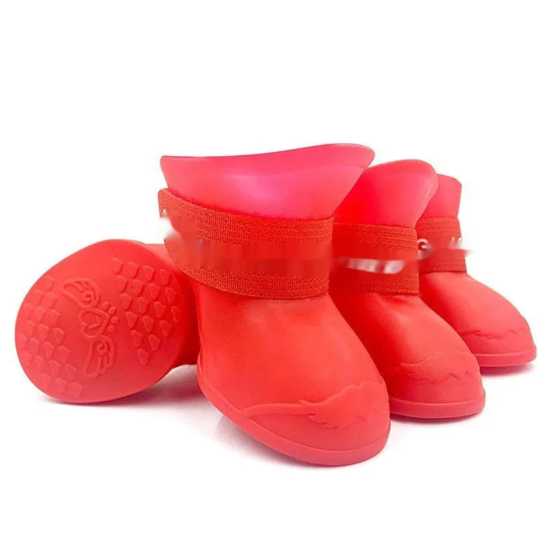 Set of four colourful rubber pet rain shoes with soft soles for dogs or cats.