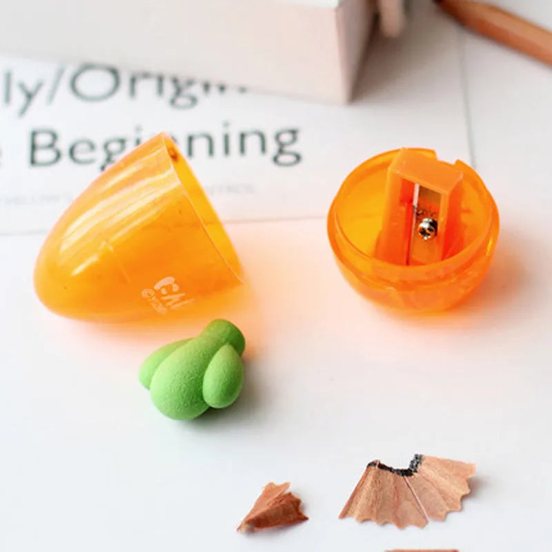 Orange plastic carrot cartoon pencil sharpener on a white background.