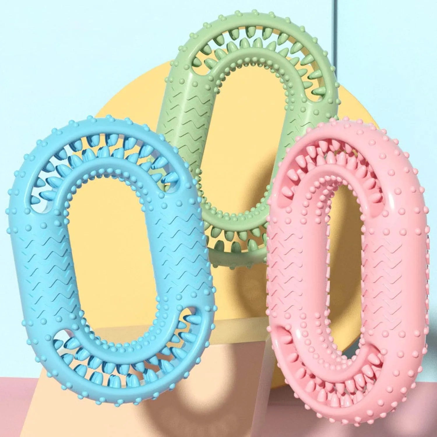 Blue O-ring shaped durable dog chew toy for aggressive chewers on a plain background.