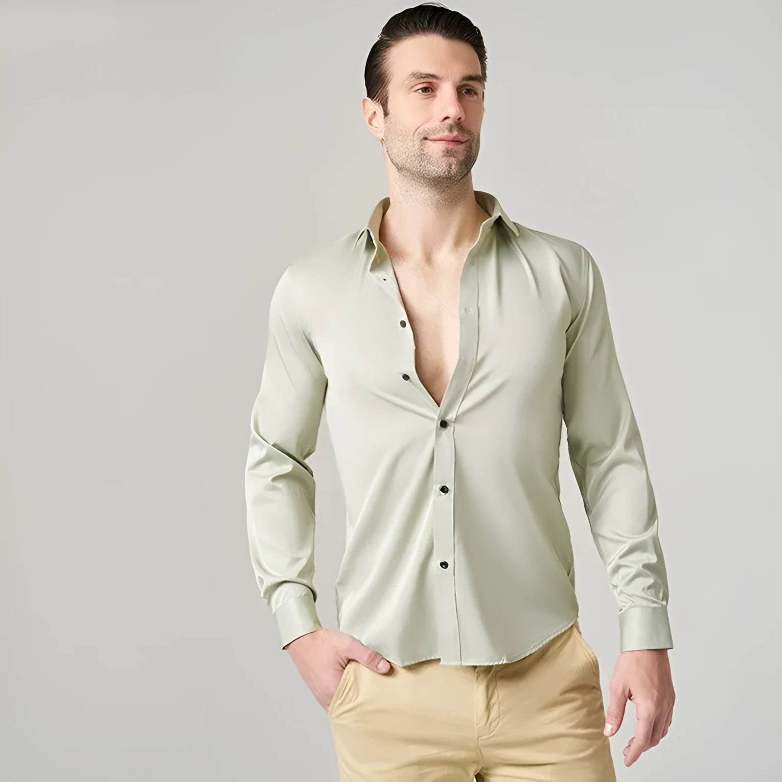 Men's solid colour stretch long sleeve work shirt made from polyester fabric on a hanger.