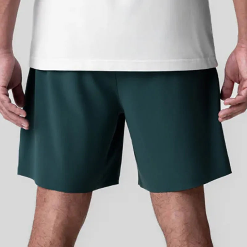 Men's grey micro-elastic sport shorts with knee-length straight-leg cut for summer training
