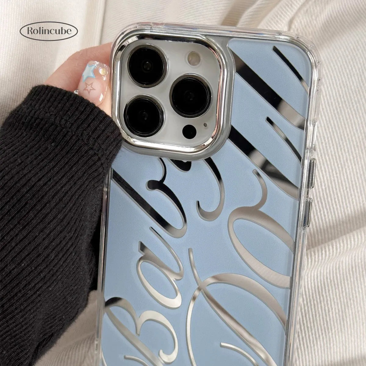 Mirror surface iPhone protective case with JMKJ letters on transparent blue TPU background
