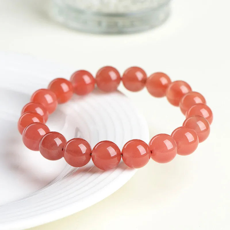 Polished South cherry red agate scattered bead bracelet shown in single and triple circle styles.