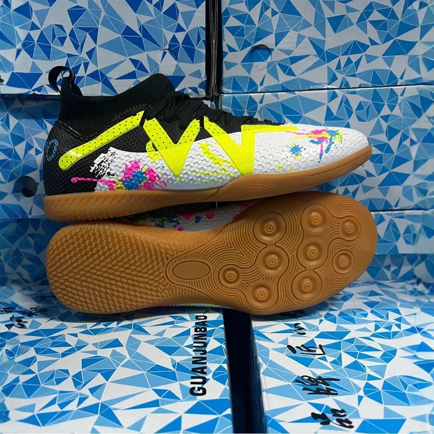 Men's low top football boots with replaceable spikes in black and yellow colourway