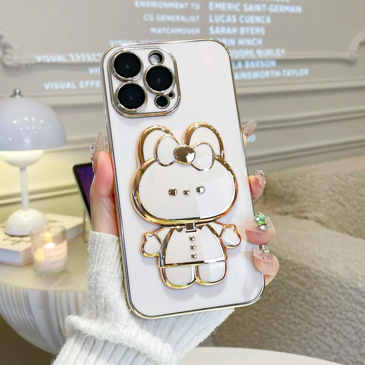 Cartoon rabbit stand mirror iPhone case in TPU with electroplated 3D design and anti-fall protection.