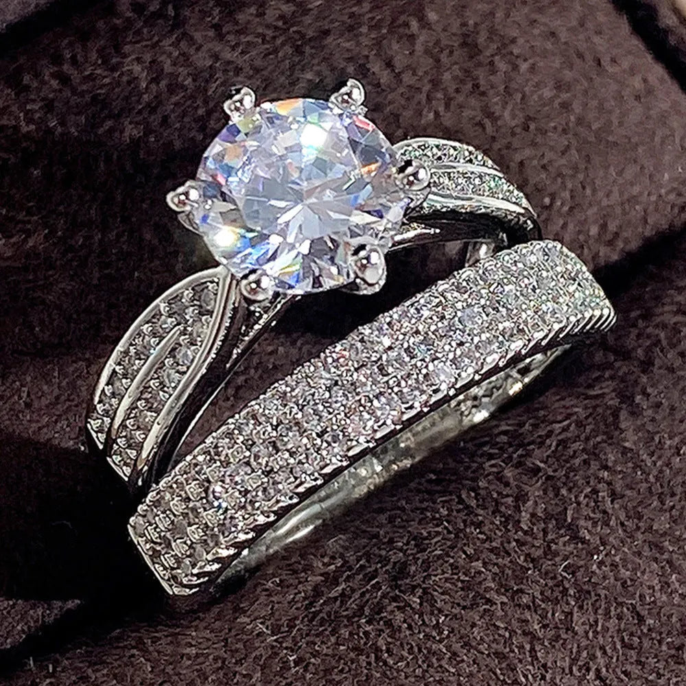 White gold colour alloy wedding bracelet combining a ring and simple bangle.