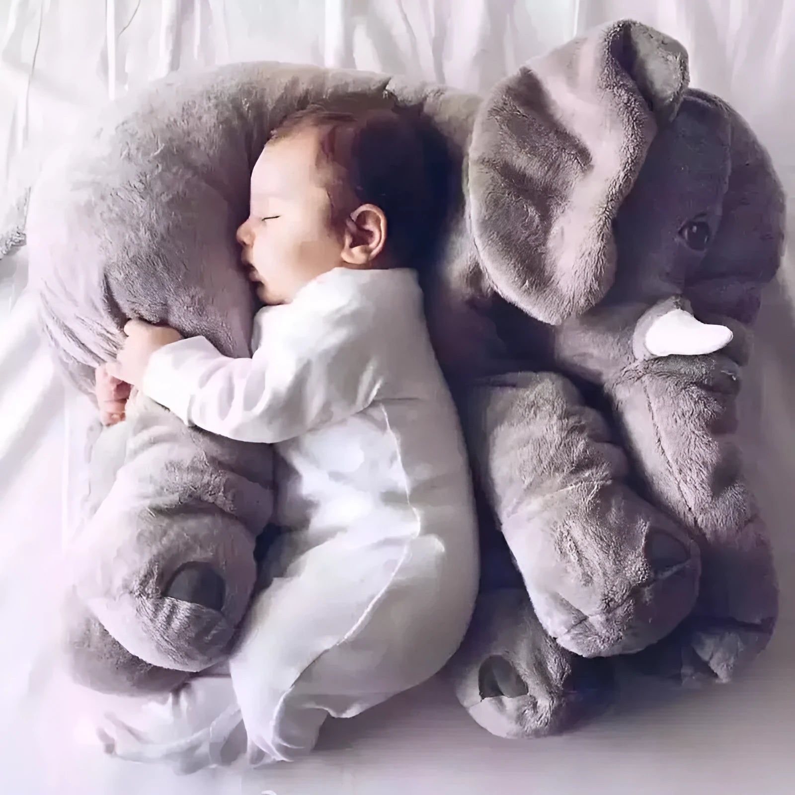 Soft grey elephant plush pillow cover for a child's bed, shown with other colour options.