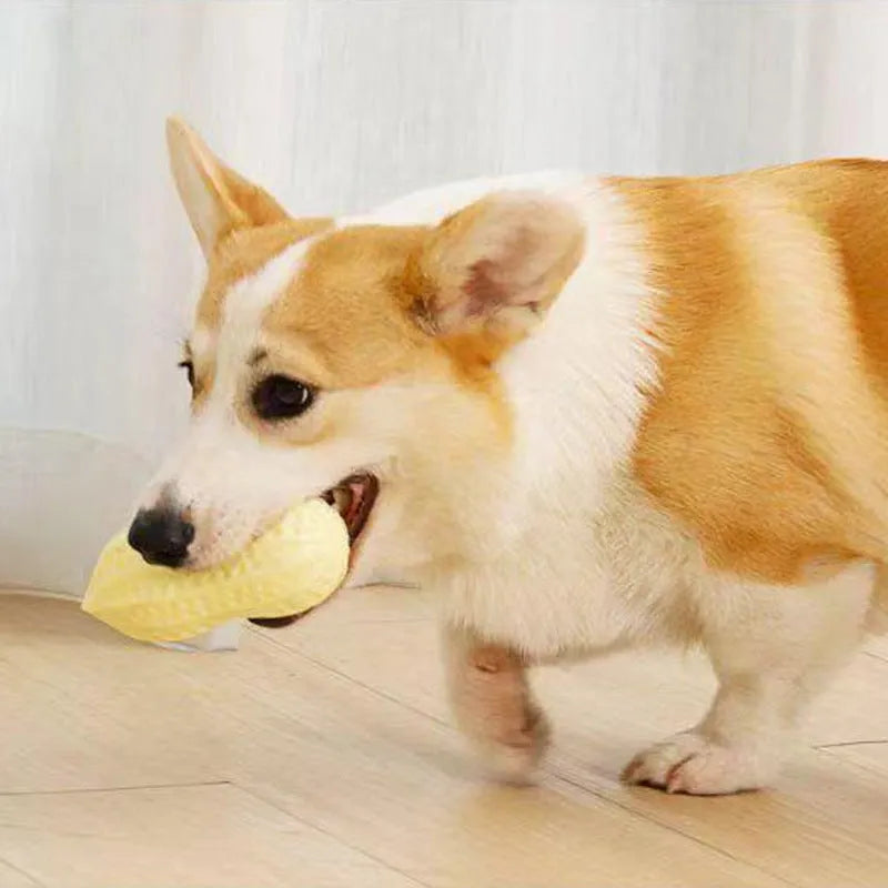 Yellow peanut-shaped dog chew toy with textured surface for teeth cleaning