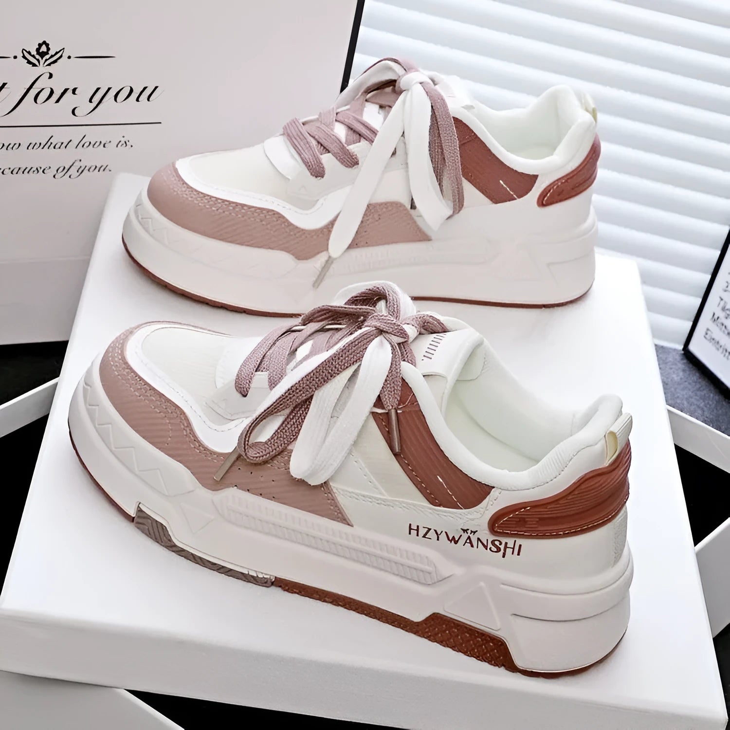 Beige children's board shoes with thick rubber sole, cross shoulder straps, and front lace-up closure on a white background.