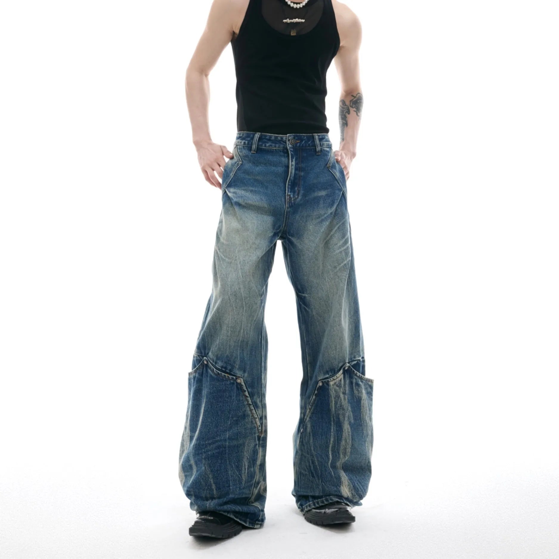 Men's Verdant blue loose-fit retro jeans with a faded burst pattern and curved knife leg design.