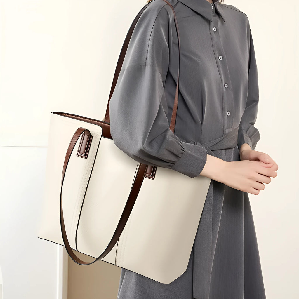 Women's black genuine leather crossbody bag with square shape and single shoulder strap.