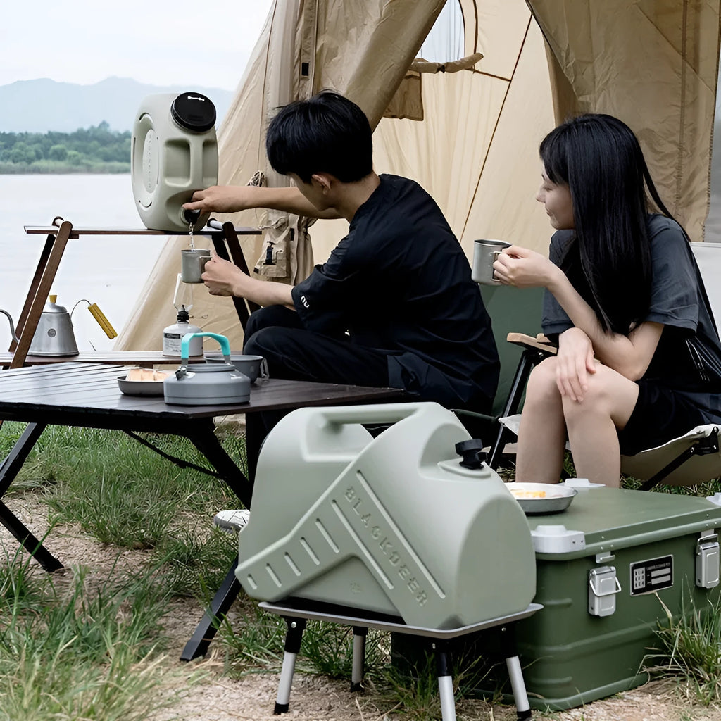 Green portable water storage tank with carry handles in backpack and snail designs