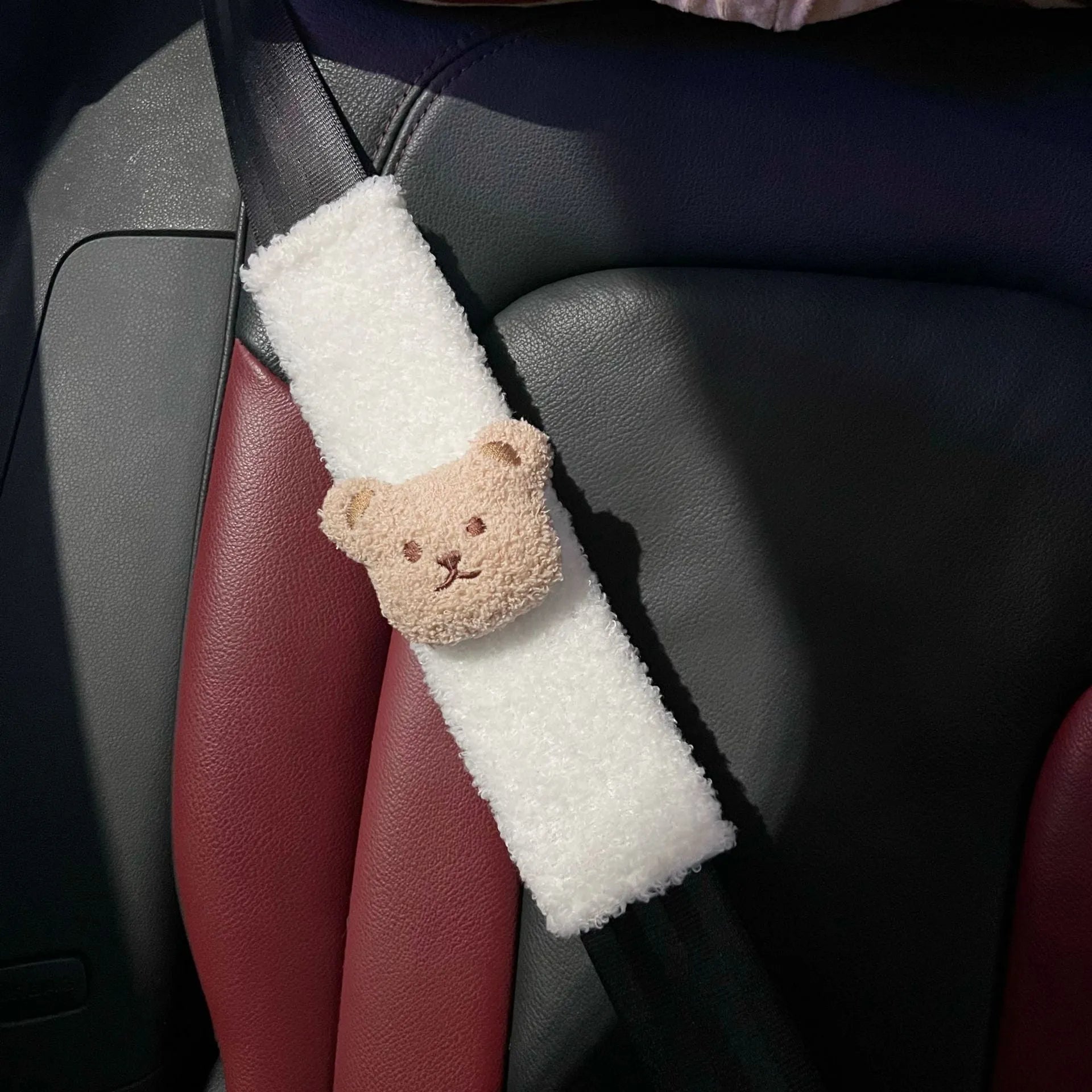 Cartoon bear plush seat belt shoulder cover for child car safety measuring 25cm by 6.5cm by 5cm.
