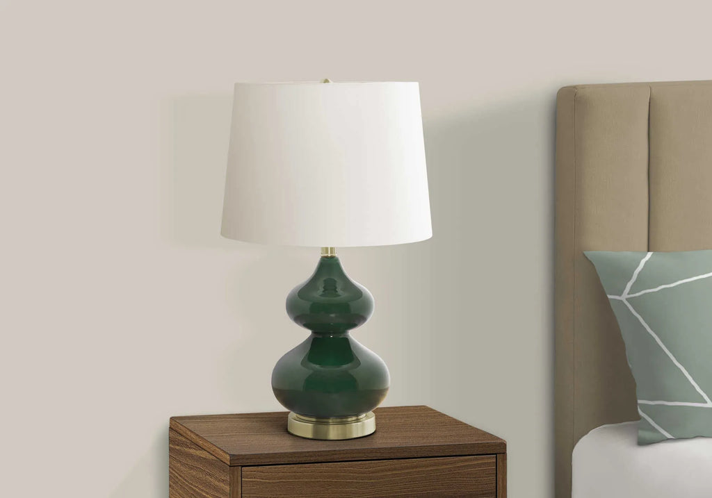 Blue crystal glass desk lamp with a cloth shade for a child's bedroom, shown on a desk.